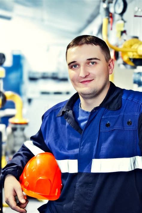 Portrait of Young Engineer in Helmet in Working Environment at Factory ...