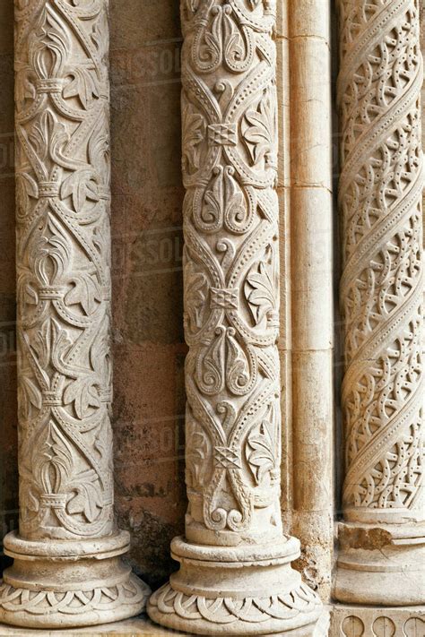 Detail of intricately carved stone pillars - Stock Photo - Dissolve