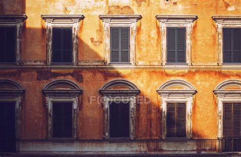 Sunlit Italian building facade — rome, pattern - Stock Photo | #171166416