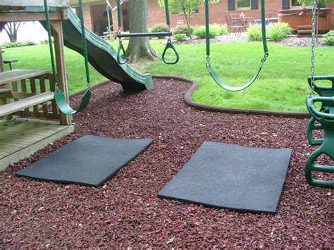 rubber mat under swings so you don't wear that mulched area down. also like the shape of the ...