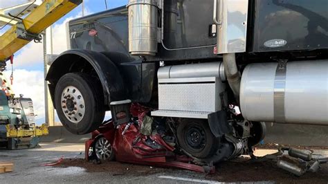 Woman Somehow Walks Away From Smashed Car In Shocking Semi-Truck Crash