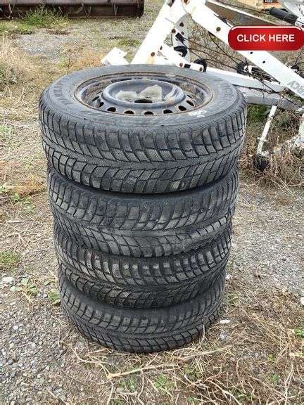 4- 205/65/15 tires on rims - Rideau Auctions