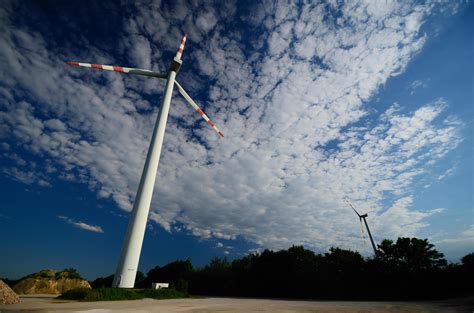 two wind turbines and clouds 6217384 Stock Photo at Vecteezy