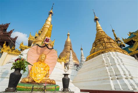 The Buddha statue and group of small pagoda in Shwedagon pagoda of Yangon township of Myanmar ...