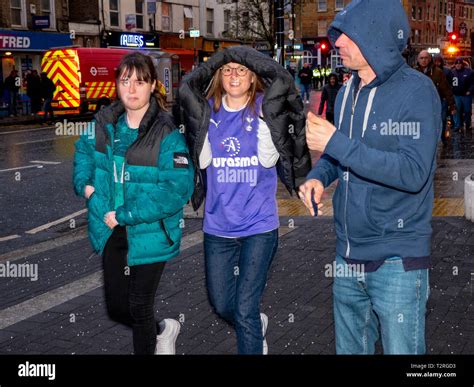 Tottenham Hotspur fans arrive in the rain for the first game at the new stadium Stock Photo - Alamy