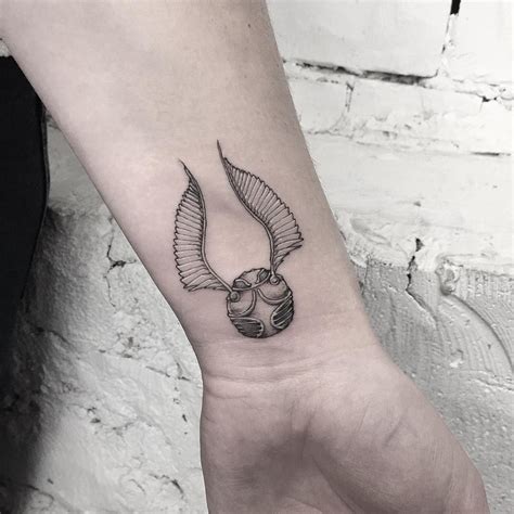 golden snitch tattoo design on wrist Tattoo Designs Wrist, Wrist Tattoos, Tattoos And Piercings ...