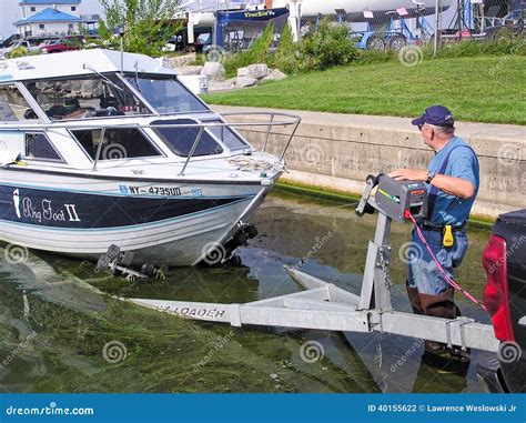 Man at Boat Launch Loading a Fishing Boat on Trailer Editorial ...