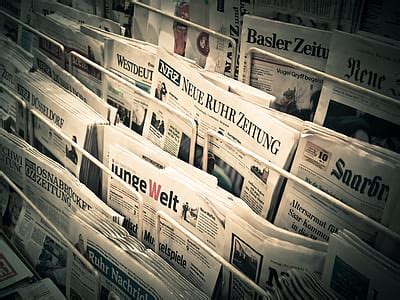 Royalty-Free photo: Pile of newspapers on rack | PickPik