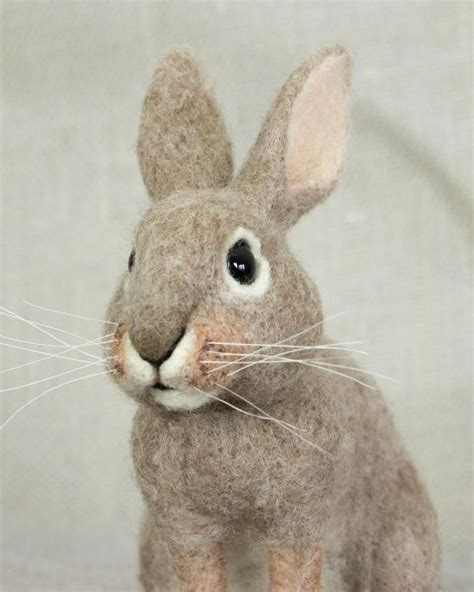 a stuffed rabbit sitting on top of a table