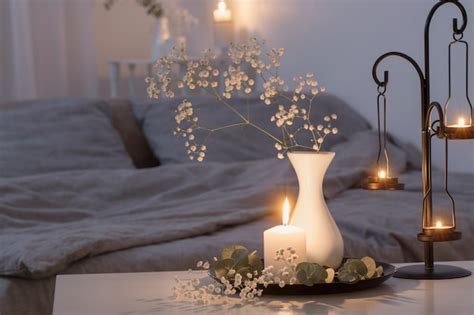 Night interior of bedroom with flowers and burning candles | Premium Photo