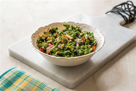 Chopped Parsley Salad with Tomatoes and Onions in Ceramic Bowl on Marble Board. Stock Image ...