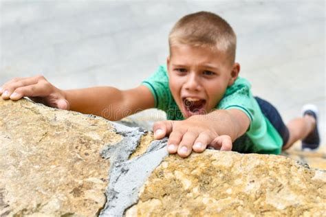 Child Athlete Falls Off a Cliff. Danger of Falling from a Hill. Climb a ...