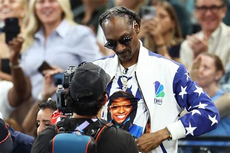 Snoop Dogg Reps Simone Biles’ Face on a Shirt at the Olympics ...Middle ...