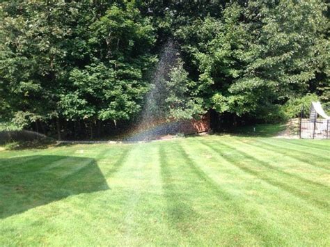 lawn yard with rainbow - Landwork Contractors