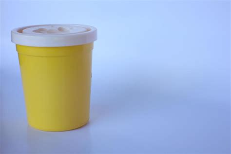 small yellow bottle on a plain white background 16108815 Stock Photo at Vecteezy