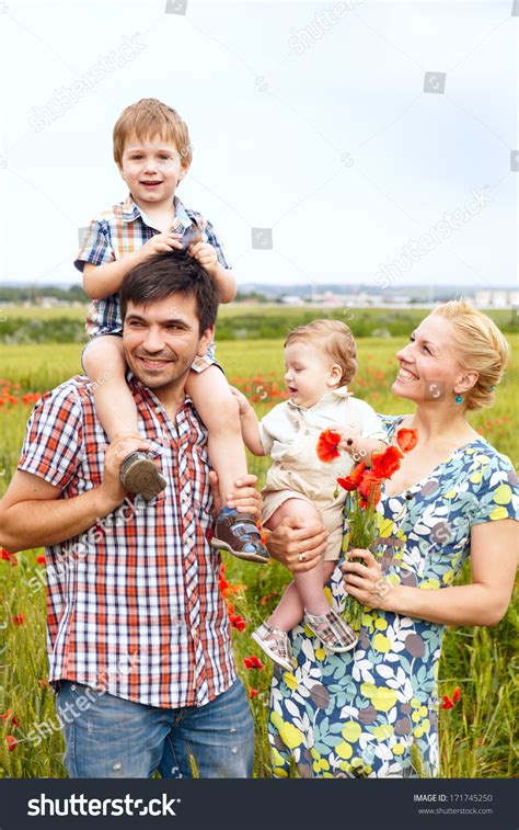 Young Happy Family Of Four Having Fun Together Outdoor. Stock Photo 171745250 : Shutterstock