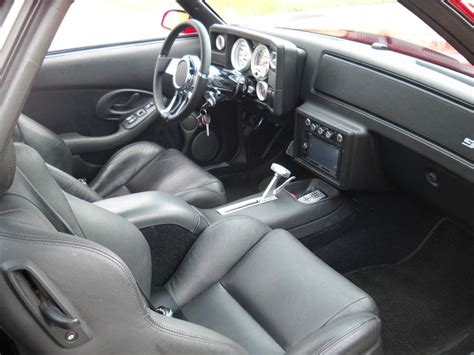 the interior of a car with black leather seats