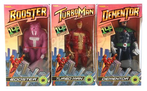 Lot #392 - JINGLE ALL THE WAY (1996) - Set of Boxed TurboMan, Booster and Dementor Figures