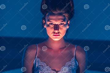 Horror. the Woman Shines a Flashlight at Herself from Below and Creates ...