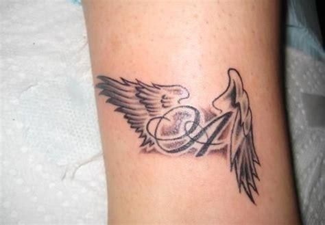 Word And Wings Tattoo | Wing tattoos on wrist, Beautiful angel tattoos, Angel tattoo for women