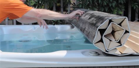 You don't need a cover lifter when you have a roll-up hot tub cover. http://www.canhottub.com ...