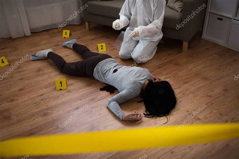 Criminalist collecting evidence at crime scene — Stock Photo © Syda_Productions #179024080