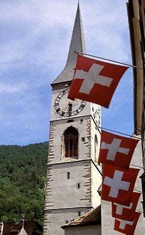 Switzerland, Chur, Flags of Graubunden and Kirche St Martin | David ...