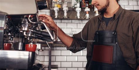 Barista using a coffee maker to make a nice cup of coffee – Jacob Lund ...