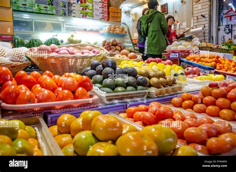 Fruits on sale at a market stall in Haeundae Market at night. An ...