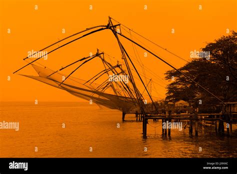 Traditional Chinese fishing nets at sunset in Kochi (Cochin), Kerala ...