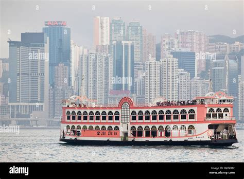 Tourist cruise boat sailing through Hong Kong Harbour Stock Photo - Alamy