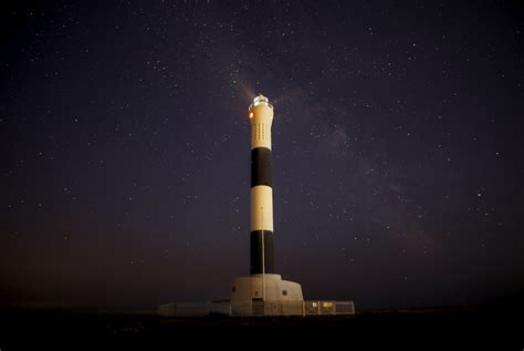 Lighthouse At Night Pictures | Download Free Images on Unsplash