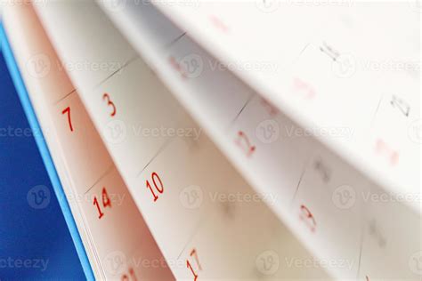 Calendar page flipping sheet close up on office table background business schedule planning ...