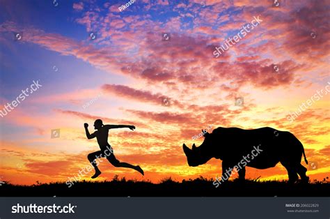 Man Running Away Rhino Sunset Savanna Stock Photo 206022829 | Shutterstock