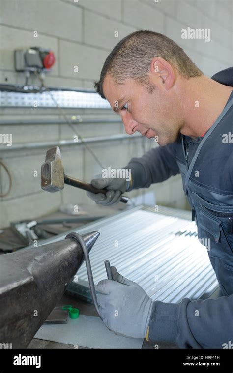 bending a metal Stock Photo - Alamy