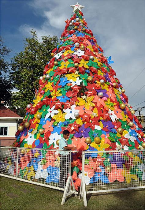 a very large christmas tree made out of paper