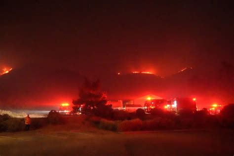 Wildfire erupts burning more than 11,000 acres near Los Angeles, mass ...