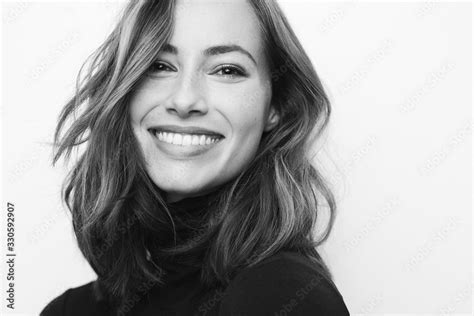 Black and white portrait of young happy woman with a big smile on her ...