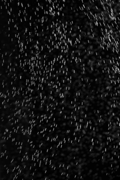 Premium Photo | Rain on black. abstract splashes of water on a black ...