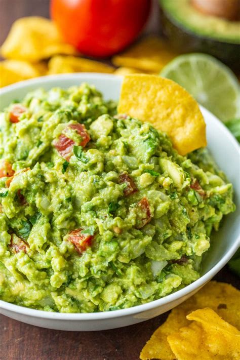 How to make the BEST EVER Guacamole. This authentic guac recipe is loaded with avocados, tomato ...