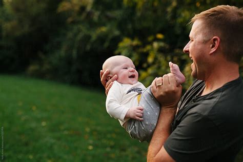 "Baby And Father Laughing Together" by Stocksy Contributor "Kelly Knox" - Stocksy