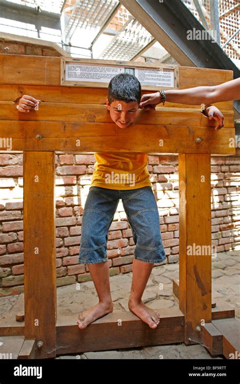 teenage boy in a pillory Stock Photo - Alamy