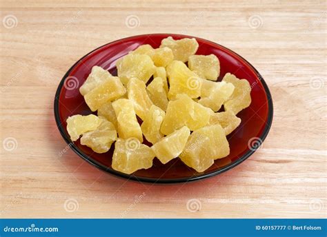 Dried Pineapple Chunks On Red Plate Stock Image - Image of light, table ...