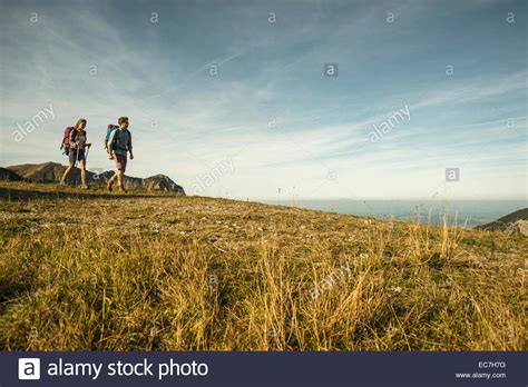 Austria, Tyrol, Tannheimer Tal, young couple hiking Stock Photo - Alamy