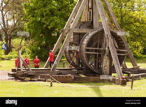 A working trebuchet ( medieval siege weapon ), and its operators, Warwick castle, Warwick ...