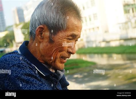 An 80-year-old Chinese man, playing outdoors Stock Photo - Alamy