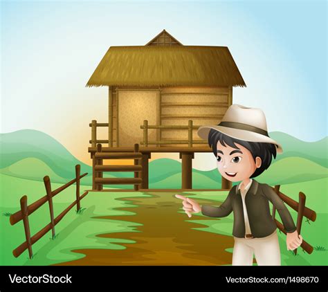 A boy with hat standing near the nipa hut Vector Image