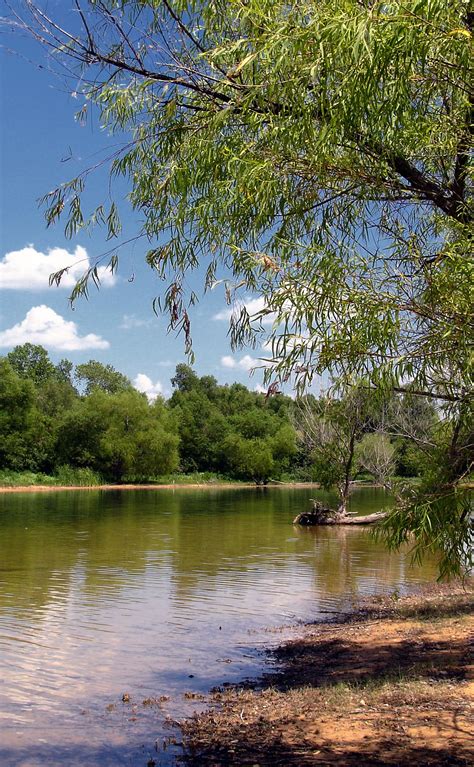 Ray Roberts Lake. Texas. Just a plain muddy bank and a lake are just ...