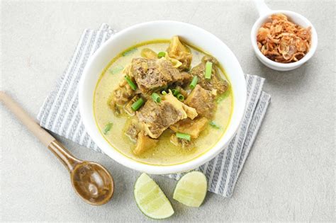 Premium Photo | Empal Gentong Cirebon traditional beef soup with coconut milk Indonesian food