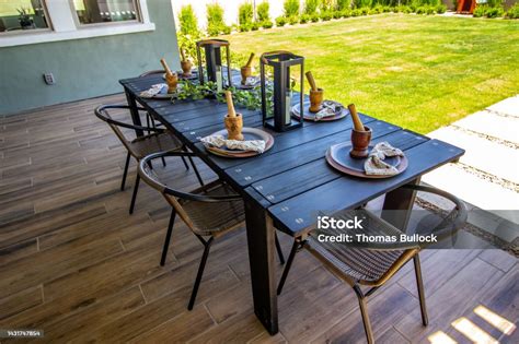 Rear Patio Wooden Table With Chairs Stock Photo - Download Image Now ...